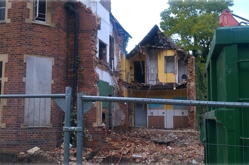 Photo showing the demolition of the old Vicarage in progress