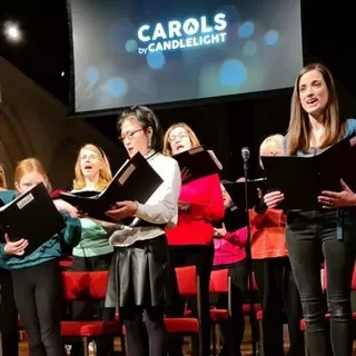 Choir singing at the Carol's by Candlelight service in 2022
